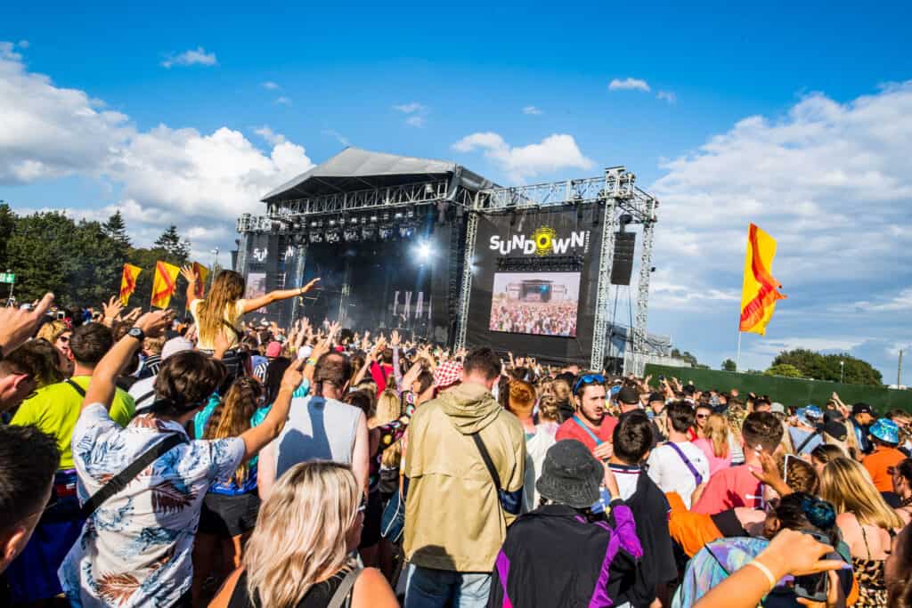 In the crowd at Sundown Festival, viewing the stage with LED Video walls and Audio Production